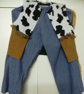 Kids Costumes to Hire - COWBOY - Cowprint & brown waistcoat & blue pants with fringing